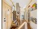 Hallway featuring hardwood floors and staircase access at 487 Carmichael Cir, Canton, GA 30115