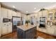 Spacious kitchen featuring a center island, stainless steel appliances, and custom cabinetry at 487 Carmichael Cir, Canton, GA 30115