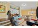 Open living area featuring a comfortable couch, office space, and hardwood floors at 487 Carmichael Cir, Canton, GA 30115