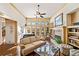 Sun-filled living room with fireplace, built-in shelves and seating area at 487 Carmichael Cir, Canton, GA 30115