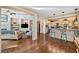 Open-concept living area with fireplace, built-in shelving, and a seamless flow to the kitchen at 487 Carmichael Cir, Canton, GA 30115