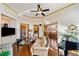 Inviting living room with hardwood flooring, fireplace, and an elegant piano at 487 Carmichael Cir, Canton, GA 30115
