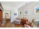 Cozy sitting room with hardwood floors, comfortable seating, and natural light at 487 Carmichael Cir, Canton, GA 30115