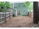 View of the home's backyard featuring a fenced perimeter, open space, and mature shade tree at 5624 Stonington Trace Pkwy, Stone Mountain, GA 30087