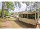 Exterior view of screened porch and lush backyard at 2509 Browns Mill Se Rd, Atlanta, GA 30354