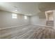 Unfinished basement with updated flooring and access to stairs at 2509 Browns Mill Se Rd, Atlanta, GA 30354