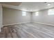 Unfinished basement with updated flooring and bright, recessed lighting at 2509 Browns Mill Se Rd, Atlanta, GA 30354