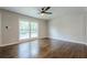 Spacious bedroom with beautiful hardwood floors and a large window offering plenty of natural light at 2509 Browns Mill Se Rd, Atlanta, GA 30354