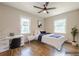 Staged bedroom with hardwood floors, natural light, and dedicated desk space at 2509 Browns Mill Se Rd, Atlanta, GA 30354