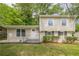 Charming two-story home with a manicured lawn and inviting front porch, perfect for suburban living at 2509 Browns Mill Se Rd, Atlanta, GA 30354