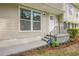 Front door features a decorative railing and landscaped flower beds at 2509 Browns Mill Se Rd, Atlanta, GA 30354