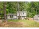 Charming home with a well-manicured lawn and a 'For Sale' sign at 2509 Browns Mill Se Rd, Atlanta, GA 30354