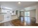 Bright open concept kitchen with a white island, hardwood floors, and a seamless flow to the dining area at 2509 Browns Mill Se Rd, Atlanta, GA 30354