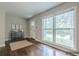 Sunlit living room with gleaming hardwood floors and a stylishly staged entryway, creating a welcoming atmosphere at 2509 Browns Mill Se Rd, Atlanta, GA 30354