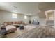 Staged basement living room with sofa and neutral decor at 2509 Browns Mill Se Rd, Atlanta, GA 30354