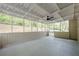 Spacious screened porch features a ceiling fan and views of the wooded backyard at 2509 Browns Mill Se Rd, Atlanta, GA 30354
