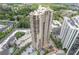 An aerial view of the high rise property with multiple floors, balconies, and surrounding lush landscape at 3481 Lakeside #901 Ne Dr, Atlanta, GA 30326