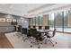 Conference room with large table, comfortable seating, modern lighting, and large windows at 3481 Lakeside #901 Ne Dr, Atlanta, GA 30326