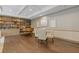 Entertainment space featuring a piano, table, and chairs surrounded by bookshelves at 3481 Lakeside #901 Ne Dr, Atlanta, GA 30326