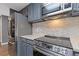 Modern kitchen with stainless appliances, beautiful backsplash and luxury counters at 3481 Lakeside #901 Ne Dr, Atlanta, GA 30326