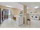 Bright laundry room with multiple washers, dryers and folding table at 3481 Lakeside #901 Ne Dr, Atlanta, GA 30326
