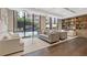 Inviting lobby area featuring comfortable seating, bookshelves, and a large window overlooking the city at 3481 Lakeside #901 Ne Dr, Atlanta, GA 30326