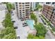 Overhead shot of a community swimming pool with parking and adjacent building and street views at 3481 Lakeside #901 Ne Dr, Atlanta, GA 30326