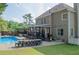 Inviting backyard featuring a refreshing pool, covered patio, and ample space for outdoor activities and enjoyment at 3606 Packhorse Run, Marietta, GA 30066