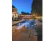 Large backyard pool with diving board, lion statues, and string lights for evening enjoyment at 3606 Packhorse Run, Marietta, GA 30066