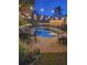 Inviting backyard pool with string lights, multiple seating areas, and mature landscaping at 3606 Packhorse Run, Marietta, GA 30066