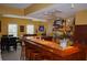Custom wet bar area with wood accents, bar seating, shelving, and display space at 3606 Packhorse Run, Marietta, GA 30066