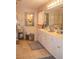 Well-lit bathroom with double vanity, soaking tub, and tiled floors offering luxurious space at 3606 Packhorse Run, Marietta, GA 30066