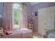 Charming purple bedroom with whimsical decor, soft curtains, and natural light at 3606 Packhorse Run, Marietta, GA 30066