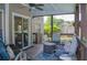 Comfortable covered patio featuring cozy seating, ceiling fan, and sliding glass door access at 3606 Packhorse Run, Marietta, GA 30066