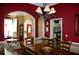 Formal dining room showcasing hardwood floors, chandelier lighting, and access to other rooms at 3606 Packhorse Run, Marietta, GA 30066