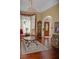 Welcoming foyer featuring hardwood floors, a chandelier, and a decorative front door at 3606 Packhorse Run, Marietta, GA 30066