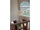 Grand foyer with a chandelier, an arched window, and a decorative monogram at 3606 Packhorse Run, Marietta, GA 30066