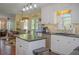 Open-concept kitchen with island and connection to breakfast nook and living spaces at 3606 Packhorse Run, Marietta, GA 30066