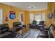 Living room featuring leather furniture, wall decor, and window views at 3606 Packhorse Run, Marietta, GA 30066