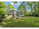 Lush backyard with patio and green grass at 4112 Willow Sw Walk, Lilburn, GA 30047