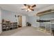 bedroom showcasing a bunk bed, ceiling fan, and built-in bookshelves with colorful storage at 4112 Willow Sw Walk, Lilburn, GA 30047