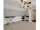 Bedroom with fan, natural light, and direct access to the bathroom at 4112 Willow Sw Walk, Lilburn, GA 30047