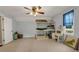 Comfortable bedroom with light blue walls, a bunk bed, ceiling fan and a bright window view to the backyard at 4112 Willow Sw Walk, Lilburn, GA 30047