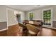 Elegant dining room features hardwood floors and bright windows at 4112 Willow Sw Walk, Lilburn, GA 30047
