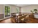 Stylish dining room with hardwood floors and a view of the backyard at 4112 Willow Sw Walk, Lilburn, GA 30047