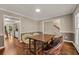 Bright dining room featuring hardwood floors and views of the kitchen at 4112 Willow Sw Walk, Lilburn, GA 30047