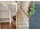 Inviting foyer with wood floors and staircase with a view of the living room with fireplace at 4112 Willow Sw Walk, Lilburn, GA 30047