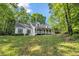 Charming two-story home with a welcoming front porch, complemented by lush green lawn at 4112 Willow Sw Walk, Lilburn, GA 30047