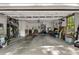 Spacious two-car garage showcasing ample storage space, tools, equipment, and a functional utility area at 4112 Willow Sw Walk, Lilburn, GA 30047