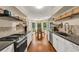 Spacious updated kitchen with hardwood floors, stainless appliances and breakfast area at 4112 Willow Sw Walk, Lilburn, GA 30047